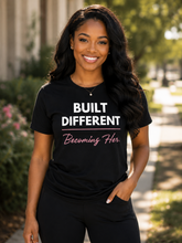 Load image into Gallery viewer, Built Different T-Shirt — “Built Different Becoming Her Tee”
