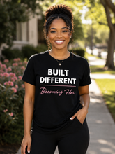 Load image into Gallery viewer, Built Different T-Shirt — “Built Different Becoming Her Tee”
